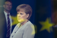 <p>               German Chancellor Angela Merkel stands behind a window with a reflection of the European flag as she waits for the President of Peru Ollanta Humala at the chancellery in Berlin, Germany, Tuesday, June 12, 2012. Merkel will hold a speech with the title "Germany in Europe - Input for European Cohesion" at an economic council of her ruling Christian Democratic Party Tuesday afternoon. (AP Photo/Markus Schreiber)