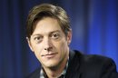 This June 11, 2013 photo shows actor Kevin Rahm, who portrays Ted Chaough on the television series "Mad Men," in Los Angeles. Rahm's character appeared in a handful episodes in past seasons as the boss of a competing advertising firm. But the recent merger of his and Don Draper's companies _ along with a shocking kiss with Peggy Olson (Elisabeth Moss) _ has thrust Ted to the forefront of the 1960s ad world drama. (AP Photo/Reed Saxon)