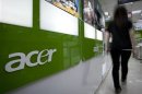 A woman walks into an Acer store located in the Guanghua Market area in Taipei