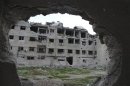 A general view of buildings, damaged by what activists said were missiles fired by a Syrian Air Force fighter jet of forces loyal to Syrian President al-Assad, at Zamalka