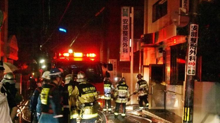 Firefighters attempt to contain a fire that has killed 10 people at a hospital in Fukuoka, western Japan on October 11, 2013