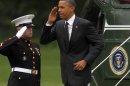 President Barack Obama returns a salute as he steps off the Marine One helicopter upon his arrival on the South Lawn of the White House in Washington, Wednesday, May, 2, 2012. Obama was returning from an unannounced trip to Afghanistan.(AP Photo/Pablo Martinez Monsivais)