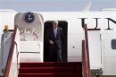 U.S. Secretary of State John Kerry disembarks from his plane as he arrives in Doha