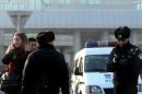 Chinese police stop a foreign journalist (L) outside the No. 1 Intermediate court in Beijing on January 22, 2014, as strict security was imposed ahead of the trial of Xu Zhiyong, one of China's most prominent dissidents