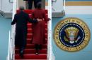 Former president Barack Obama and his wife Michelle board Special Air Mission 28000, a Boeing 747 which serves as Air Force One, at Joint Base Andrews, Maryland