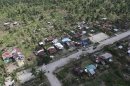 Handout provided by the Philippine Army 10th Infantry Division shows an aerial view of damaged houses caused by flash floods in Compostela Valley province, southern Philippines