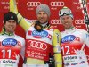 World Cup overall points leader Svindal of Norway celebrates on podium with second placed Marsaglia of Italy and third placed Heel of Italy after the men's World Cup Super-G race in Val Gardena