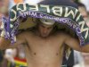 Rafael Nadal of Spain wipes himself with a towel during his men's singles tennis match against Steve Darcis of Belgium at the Wimbledon Tennis Championships, in London