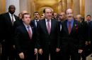 Iraq's Prime Minister Nouri al-Maliki, center, walks with the House Foreign Affairs Committee ranking Democrat Rep. Eliot Engel, D-N.Y., right, and the committee's chairman Rep. Ed Royce, R-Calif., on Capitol Hill in Washington, Wednesday, Oct. 30, 2013, before their meeting. Earlier, the prime minister met with Vice President Joe Biden. (AP Photo/Molly Riley)