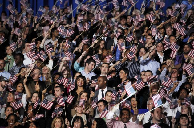 U.S. President Barack Obama supporters cheer and wave flags at election night victory rally in Chicago