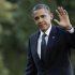 U.S. President Obama waves as he returns to the White House in Washington