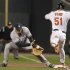 Yankees' Teixeira makes a catch to force out Orioles' Ford at first base after Ford hit a sacrifice bunt during Game 1 in their MLB ALDS playoff baseball series in Baltimore