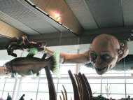 In this photo taken Saturday, Nov. 24, 2012, a giant sculpture of Gollum, a character from "The Hobbit," is displayed in the Wellington Airport to celebrate the upcoming premiere of the first movie in the trilogy, in Wellington, New Zealand. The sculpture was created at Weta Workshop, part of Peter Jackson's movie empire in the Wellington suburb of Miramar. The world premiere of "The Hobbit: An Unexpected Journey" is Nov. 28 at Wellington's Embassy Theatre. (AP Photo/Nick Perry)