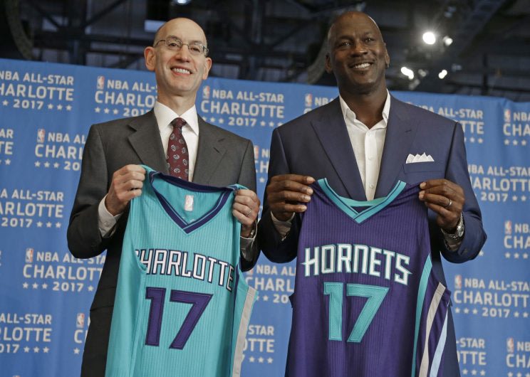 NBA Commissioner Adam Silver (left) and Charlotte Hornets owner Michael Jordan pose for a photo during a June 23, 2015, news conference to announce Ch...