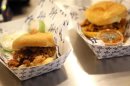 A pulled pork and a pulled chicken sandwich are displayed during a media food tour at Yankee Stadium in New York