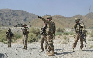 US soldiers gather after a clash between Taliban and …