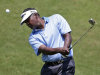 Vijay Singh, from Fiji, chips onto the second green during the first round of The Players championship golf tournament at TPC Sawgrass, Thursday, May 9, 2013, in Ponte Vedra Beach, Fla. (AP Photo/Chris O'Meara)