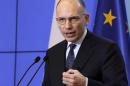 Italian Prime Minister Enrico Letta gestures as he speaks during a news conference at the Prime Minister's Chancellery in Warsaw