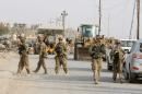U.S. soldiers gather in the town of Gwer, northern Iraq