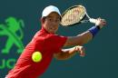 Kei Nishikori of Japan plays a quarterfinal match against Gael Monfils of France during Day 11 of the Miami Open on March 31, 2016 in Key Biscayne, Florida