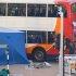 An AFP reporter saw a man's legs protruding from under the double-decker bus