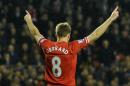 Liverpool's English midfielder Steven Gerrard celebrates after scoring during a match at Anfield in Liverpool on January 18, 2014