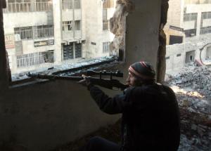 A rebel fighter inside a building in the northern Syrian …