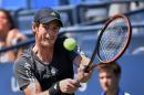 Andy Murray of Britain returns a shot to Robin Haase of the Netherlands during their 2014 US Open men's singles match at the USTA Billie Jean King National Tennis Center August 25, 2014 in New York