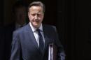 Britain's Prime Minister David Cameron leaves Number 10 Downing Street to speak at Parliament in London