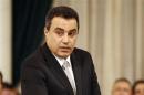 Tunisian's new Industry Minister Mehdi Jomaa takes the oath of office at the Carthage Palace