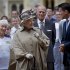 Britain's Queen Elizabeth II, second left, her husband Prince Philip, second right, London 2012 Chairman Sebastian Coe, right, and seventy four year-old Olympic torch bearer Gina Macgregor,  left, at Windsor Castle, Windsor, England Tuesday July 10, 2012. The London 2012 Olympic Games will start on July 27, 2012.   (AP Photo/Ben Stansall, Pool)