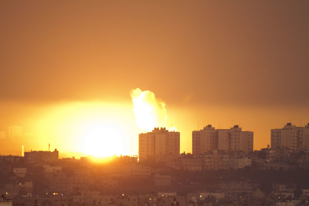 Explosion and smoke rise following an Israeli air strike in the northern Gaza Strip, seen from the Israel Gaza Border, southern Israel, Thursday, Nov. 15, 2012. (AP Photo/Ariel Schalit)