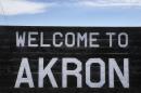 In this Nov. 6, 2013 photo, a sign welcomes visitors to the rural town of Akron, the county seat of Washington County, Colo. A day earlier, a majority in Washington and four other counties on Colorado's Eastern Plains voted yes on the creation of a 51st state, largely over residents' alienation from voters statewide on issues such as civil unions for gay couples, new renewable energy standards, and limits on ammunition magazines. (AP Photo/Brennan Linsley)