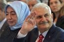 Turkey's Transportation Minister Yildirim greets members of his party during the AKP extraordinary congress in Ankara