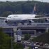 An aircraft of German air carrier Lufthansa rolls on a runway above a highway at Fraport airport in Frankfurt
