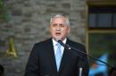 Guatemalan President Otto Perez Molina speaks during the swearing in ceremony of the new Defence Minister William Mancilla, in Guatemala City, August 14, 2015