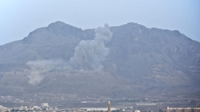 Smoke rises after a Saudi-led airstrike hit a site believed to be one of the largest weapons depot on the outskirts of Yemen&#39;s capital, Sanaa, on Tuesday, May 19, 2015. The Saudi-led coalition on Tuesday carried out the heaviest airstrikes near the Yemeni capital since a five-day truce with Yemen&#39;s Shiite rebels expired earlier this week, hitting weapons depots in the mountains surrounding Sanaa and sending dozens of families fleeing their homes in panic. (AP Photo/Hani Mohammed)