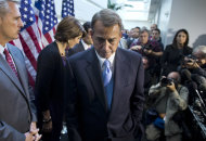 House Speaker John Boehner, R-Ohio, walks away from the microphone during a news conference after a House GOP meeting on Capitol Hill, Tuesday, Oct. 15, 2013, in Washington. House GOP leaders Tuesday floated a plan to fellow Republicans to counter an emerging Senate deal to reopen the government and forestall an economy-rattling default on U.S. obligations. But the plan got mixed reviews from the rank and file, and it was not clear whether it could pass the chamber. (AP Photo/ Evan Vucci)