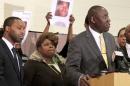 Samaria Rice, the mother of Tamir Rice looks on as Benjamin Crump speaks during a news conference in Cleveland