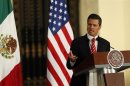 Mexican President Nieto speaks during a joint news conference with U.S. President Obama at the Palacio Nacional in Mexico City
