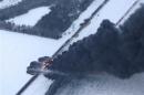 Smoke rises from scene of a derailed train near Casselton, North Dakota
