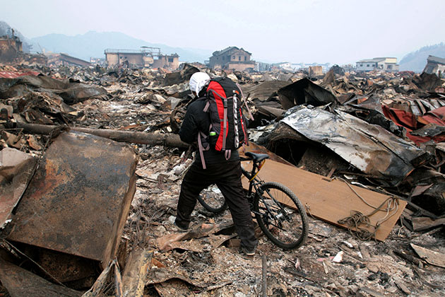 A young man walks through the devastation in Otsuchi, Japan. (Getty Images)