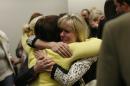 Linda Cluff, sister of Michelle MacNeill hugs friends after court was adjourned following the guilty verdict against Martin MacNeill. MacNeill was found guilty of murder and obstruction of justice early Saturday morning, Nov. 9, 2013. (AP Photo/The Salt Lake Tribune, Scott Sommerdorf)