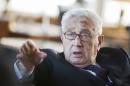 Former U.S. Secretary of State Kissinger gestures during a reception for his 90th birthday in Berlin