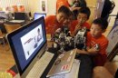 In this Aug. 14, 2013, photo, children look at a computer presentation on how to assemble Lego parts during a Digital Media Academy workshop in Stanford, Calif. Lego's new Mindstorms sets rolling out next month are keenly anticipated by Silicon Valley engineers_many of whom were drawn to the tech sector by the flagship kits that came on the market in 1998, introducing computerized movement to the traditional snap-together toy blocks and allowing the young innovators to build their first robots. (AP Photo/Marcio Jose Sanchez)