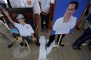 Supporters of the Cambodian People Party hold posters of Prime Minister Hun Sen during an election rally on the last day of campaigning in central Phnom Penh