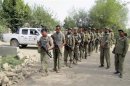 Members of the Afghan Local Police (ALP) prepare to embark on a foot patrol at the Char Darah district of Kunduz province