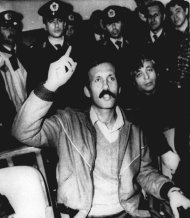 FILE – In this 1989 file photo Mohammed Rashed speaks during his trial in Athens, Greece, in connection with a fatal 1982 Pan Am 830 bombing. Rashed tucked a bomb beneath a jetliner seat cushion, set the timer and disembarked with his wife and child when the flight touched down in Tokyo. The device exploded as the jet continued on to Honolulu, killing a Japanese teenager in an attack that investigators linked to a terrorist organization known for making sophisticated bombs. It would be 20 years before the Jordanian-born bomber, and one-time apprentice to Abu Ibrahim, currently featured on the FBI list of most wanted terrorists, would admit guilt in an American courtroom. Now, credited for his cooperation against associates, Rashed is about to be freed from federal prison after more than two decades behind bars in Greece and the United States. (AP Photo/File)
