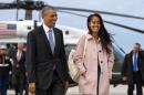 FILE - In a Thursday, April 7, 2016 file photo, President Barack Obama jokes with his daughter Malia Obama as they walk to board Air Force One from the Marine One helicopter, as they leave Chicago en route to Los Angeles. The White House announced Sunday, May 1, 2016, that Malia Obama will take a year off after high school and attend Harvard University in 2017. (AP Photo/Jacquelyn Martin, File)