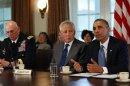 U.S. Army General Odierno and Secretary of Defense Hagel listen as President Obama speaks to the media after a meeting on sexual assault in the military at the White House in Washington